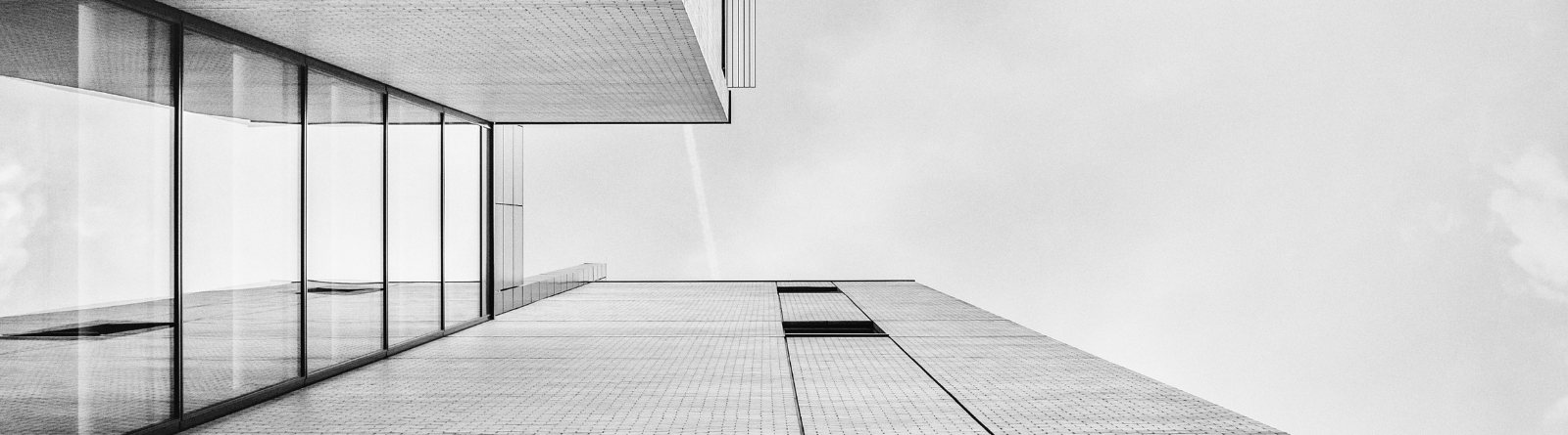 Gray building with floor to ceiling windows
