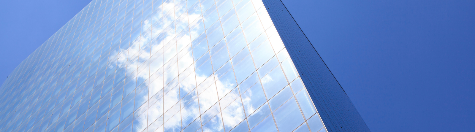 Skyscraper building against blue sky