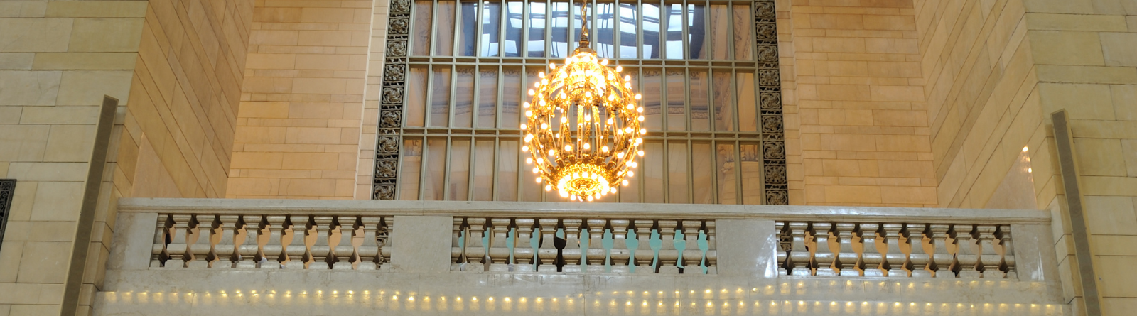 Header Image_Lit Chandelier near balcony